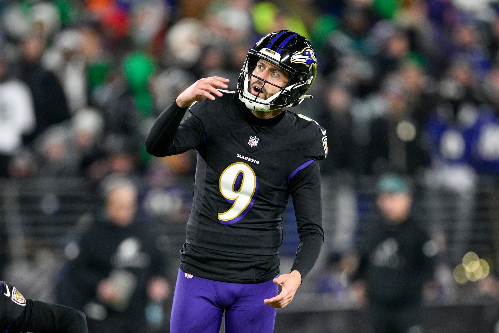 Baltimore Ravens kicker Justin Tucker watches his kick as he misses a second field goal attempt during the second half of an NFL football game against the Philadelphia Eagles, Sunday, Dec. 1, 2024, in Baltimore. (AP Photo/Nick Wass)