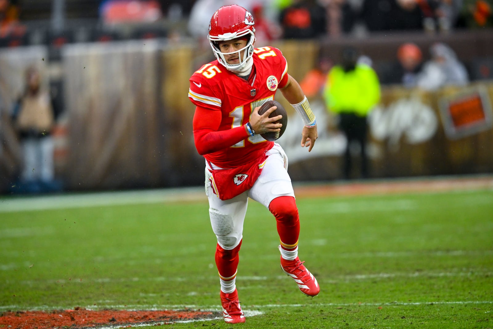 Kansas City Chiefs quarterback Patrick Mahomes (15) runs against the Cleveland Browns during the first half of an NFL football game, Sunday, Dec. 15, 2024, in Cleveland. (AP Photo/David Richard)