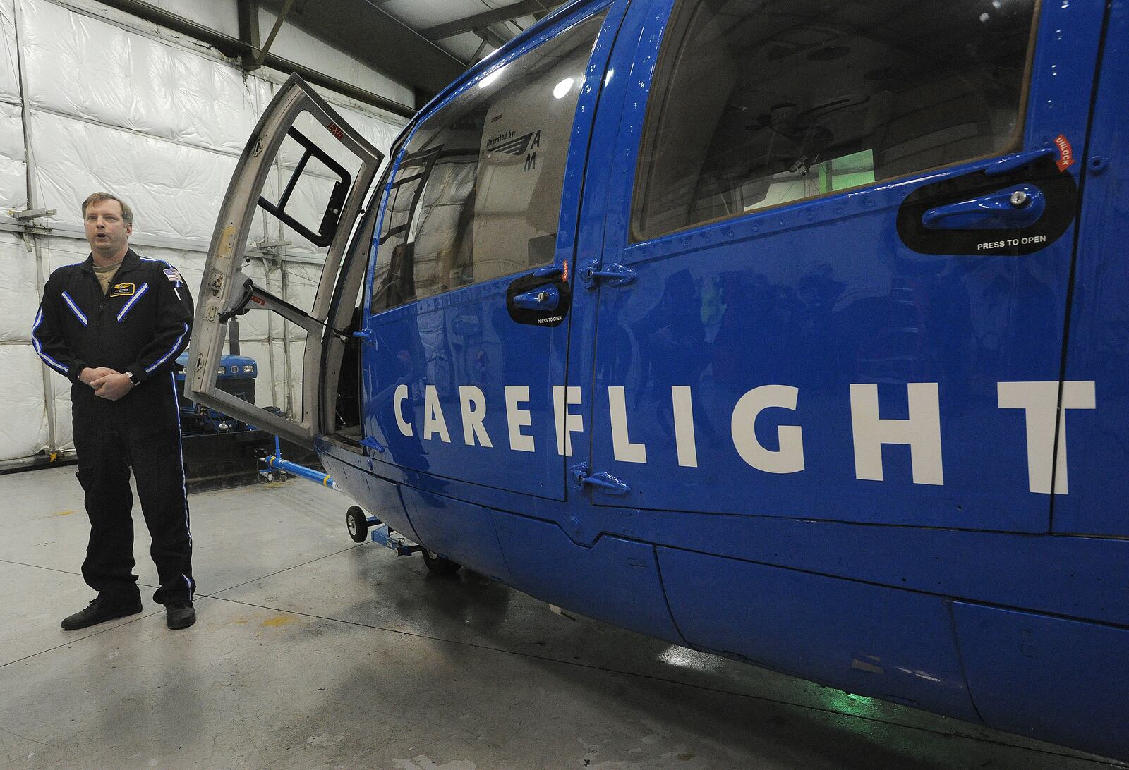 CareFlight pilot, Nick Stevenson, talks to the media, Friday, Feb. 12, 2021 at the Moraine Airpark, about flying and preparation of the aircraft for cold weather. MARSHALL GORBY\STAFF