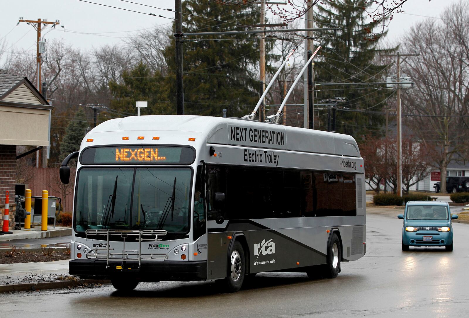 The NexGen electric trolley reaches the end of the route 5 trolley line on Southmoor Circle in Kettering. Greater Dayton RTA will buy 26 of the buses for about $1.2 million each and another 15 once federal funding is lined up. LISA POWELL / STAFF