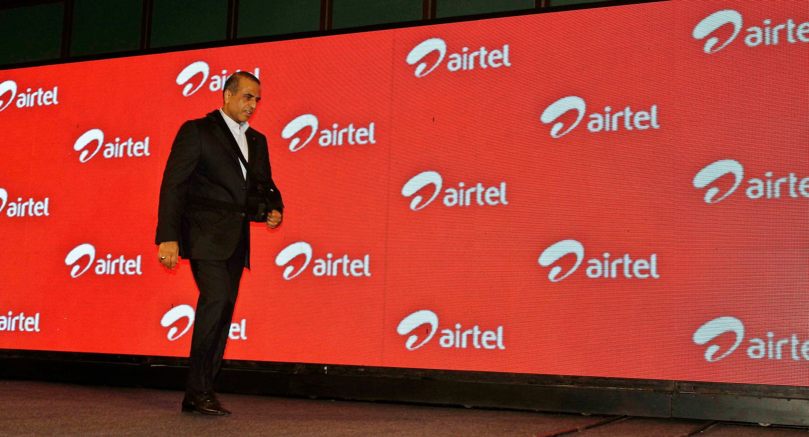 FILE- In this Tuesday, April 10, 2012, file photo, Bharti Airtel Ltd. Chairman and Managing Director Sunil Mittal walks as he attends a press conference during launch of Airtel's 4G services, in Kolkata, India. (AP Photo/Bikas Das, File)