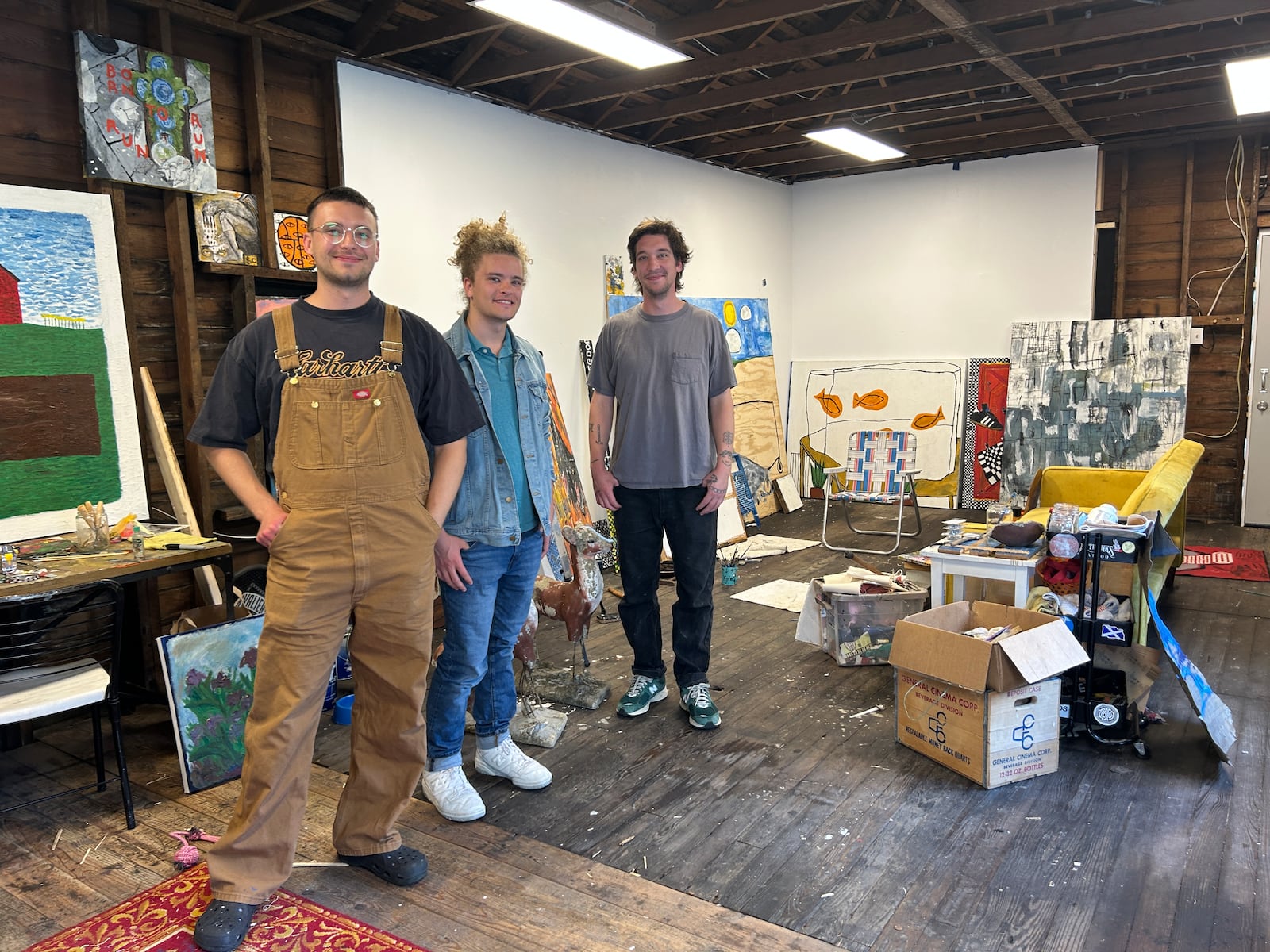 Eli, Cole and Kyle Thiele hang out in Kyle's painting studio. Contributed 