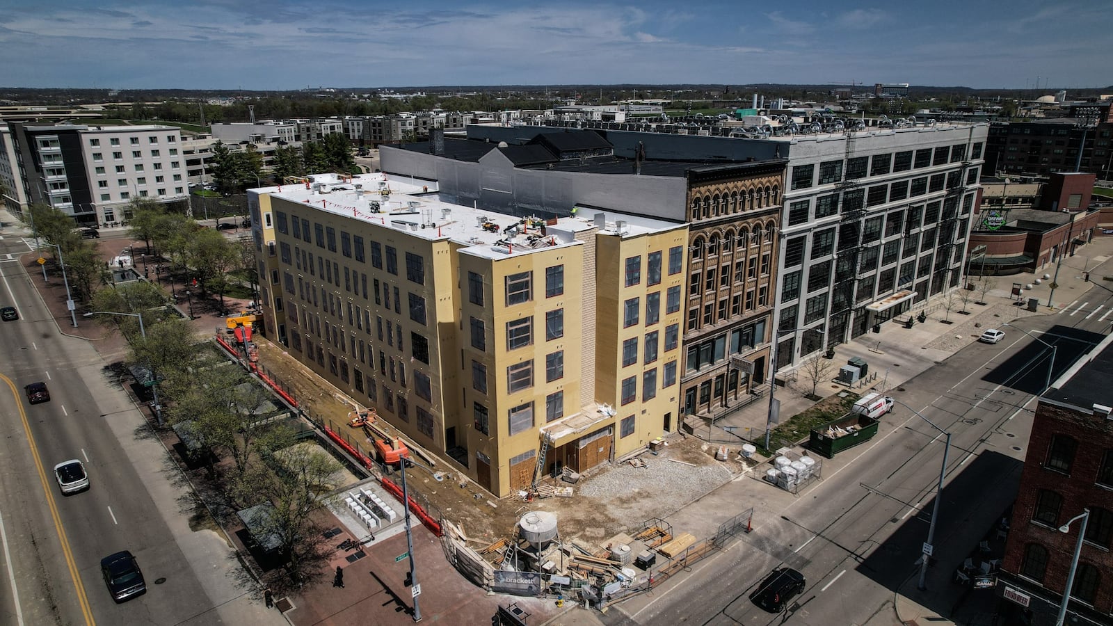 After delays, new apartments buildings in downtown Dayton are now taking shape like this one at North Patterson and East First Street. JIM NOELKER/STAFF