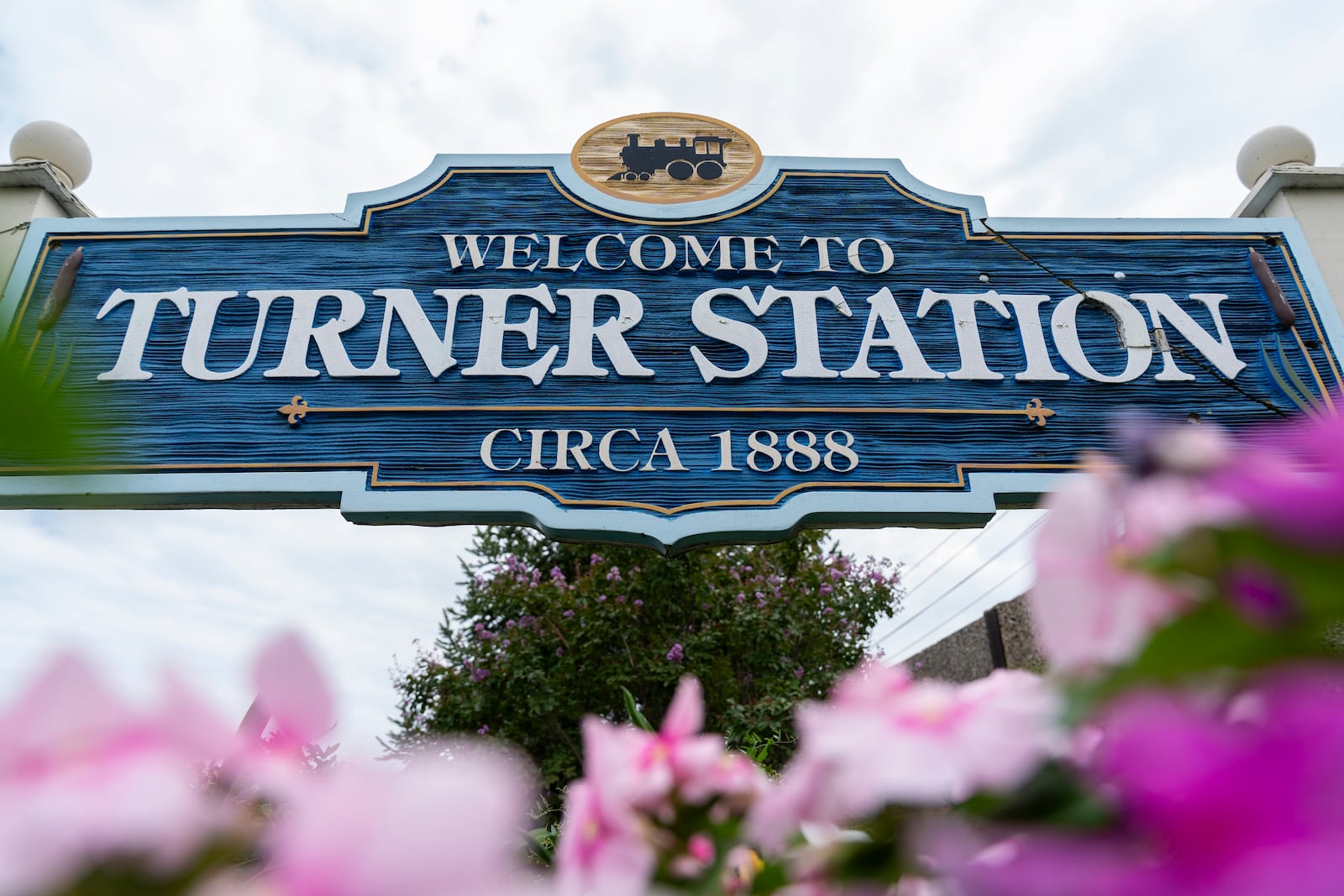 A community welcome sign on the corner Main Street and Dundalk Avenue is pictured, Friday, Aug. 16, 2024, in Turner Station, Md. (AP Photo/Stephanie Scarbrough)