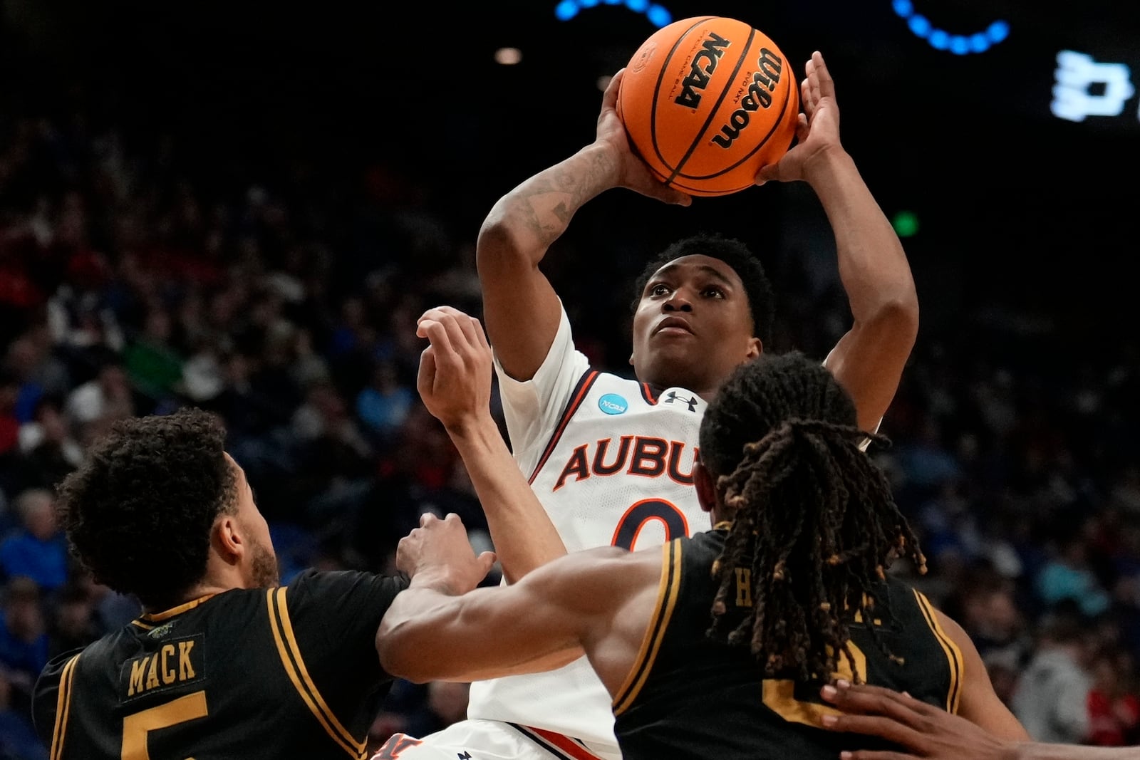 Auburn guard Tahaad Pettiford (0) shoots over Alabama State guard Tyler Mack (5) during the first half in the first round of the NCAA college basketball tournament, Thursday, March 20, 2025, in Lexington, Ky. (AP Photo/Brynn Anderson)