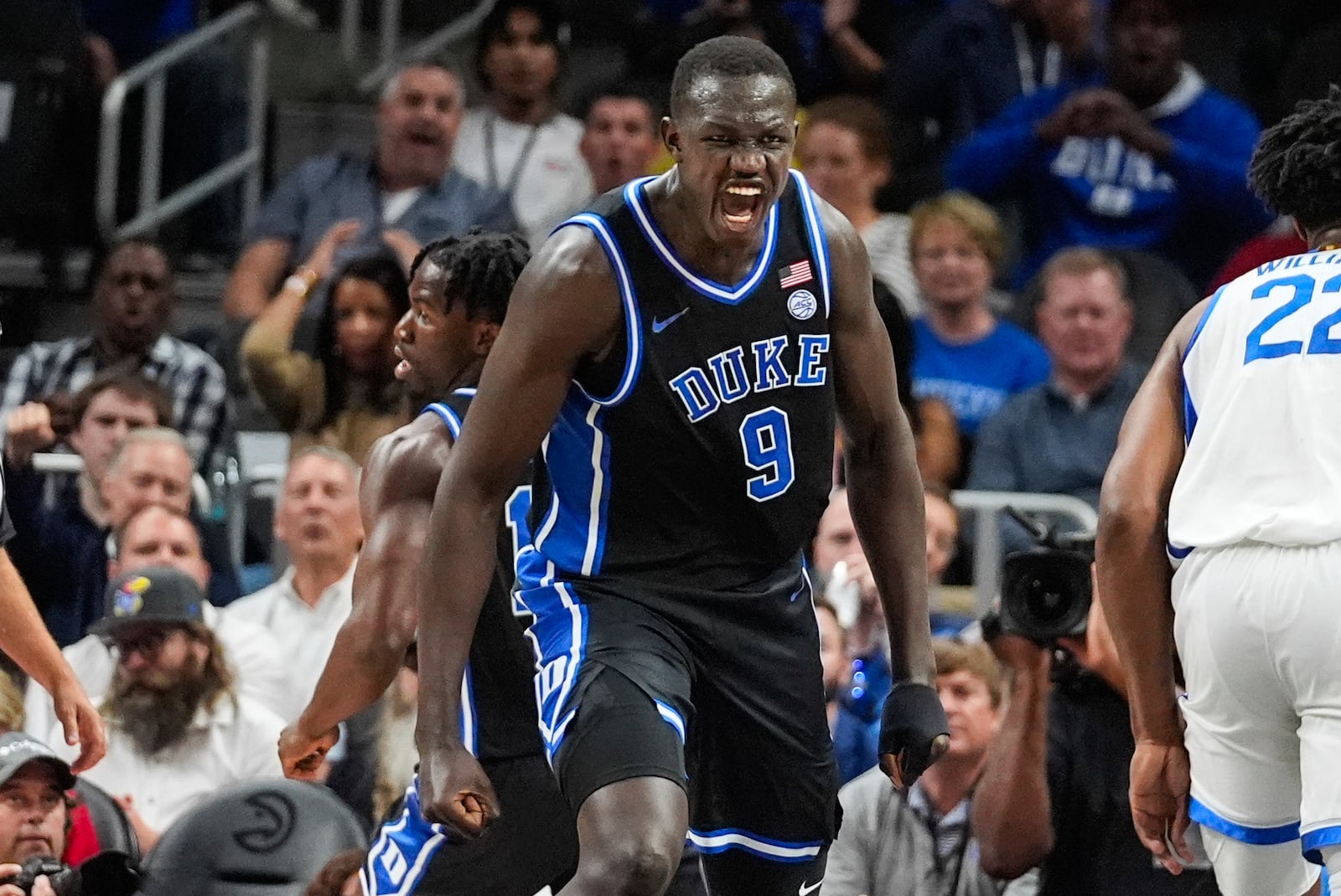 Duke Blue center Khaman Maluach (9) reacts after a Blue Divila's basket during the first half of an NCAA college basketball game against Kentucky, Tuesday, Nov. 12, 2024, in Atlanta. (AP Photo/John Bazemore )