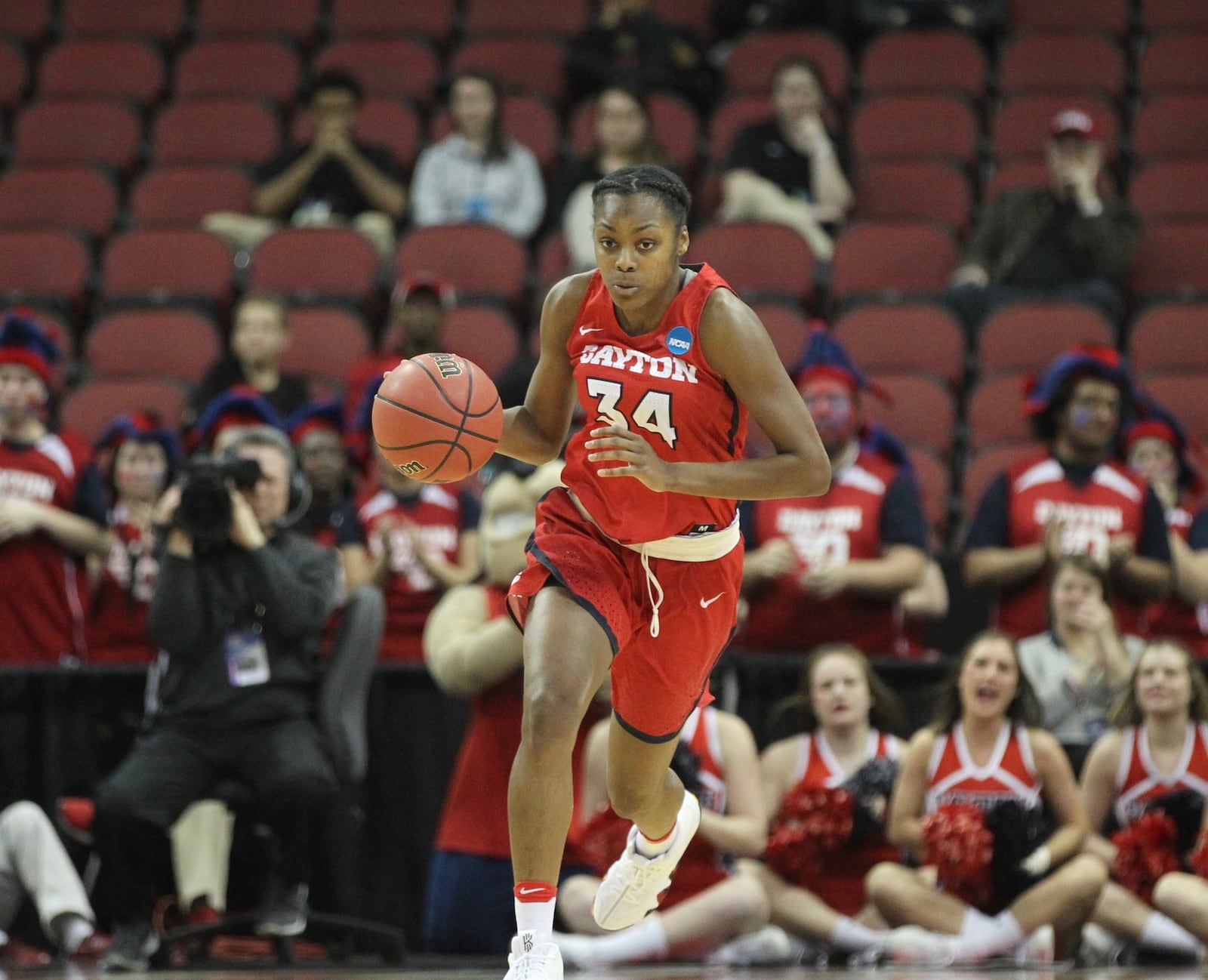 Dayton’s JaVonna Layfield brings the ball up the court against Marquette on Friday, March 16, 2018, at the KFC Yum! Center in Louisville, Ky. David Jablonski/Staff