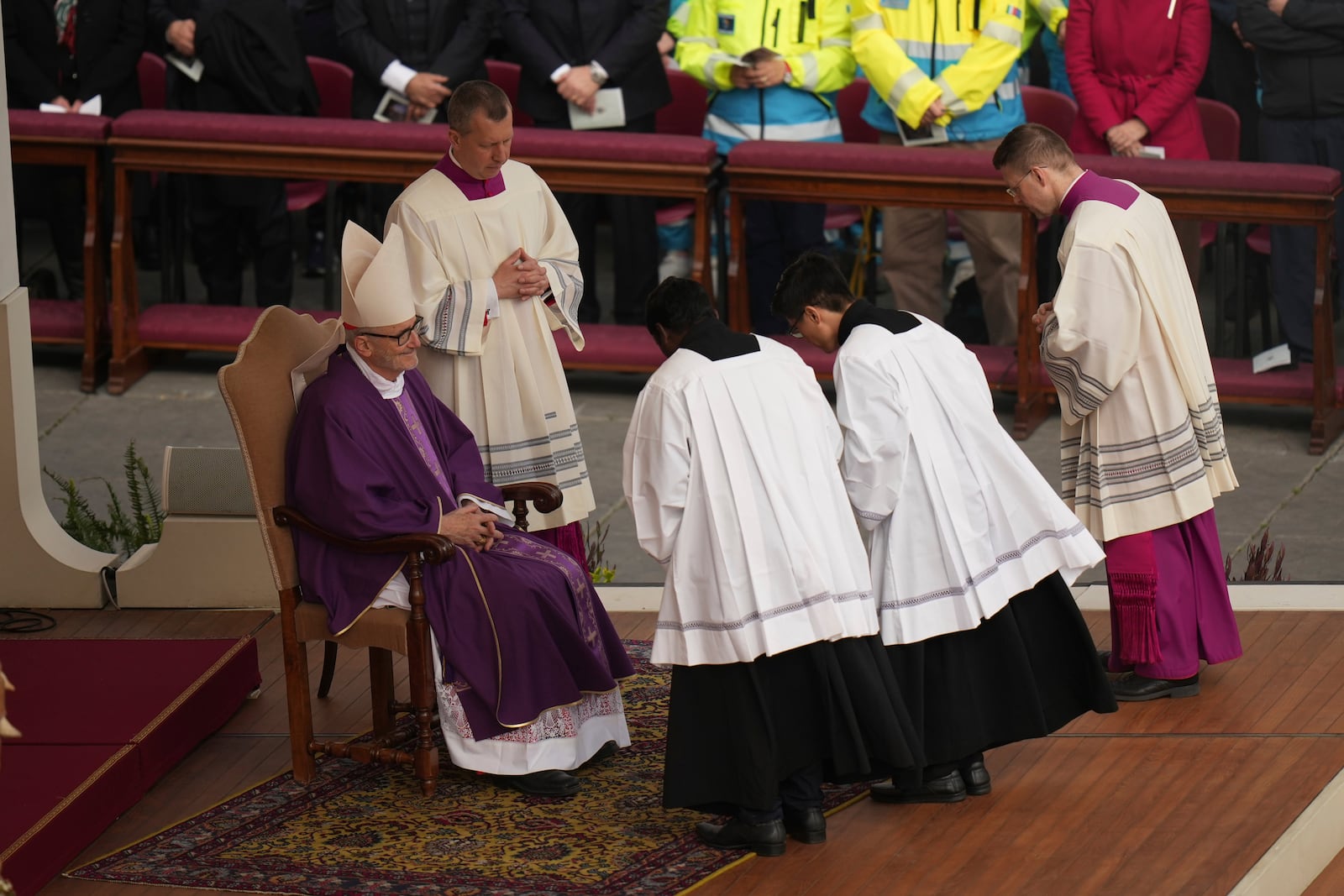 Cardinal Michael Czerny, left, delegate of Pope Francis who is being treated for pneumonia at Rome's Agostino Gemelli Polyclinic, celebrates a mass for the members of the world of volunteers in St. Peter's Square at The Vatican, Sunday, March 9, 2025. (AP Photo/Francisco Seco)