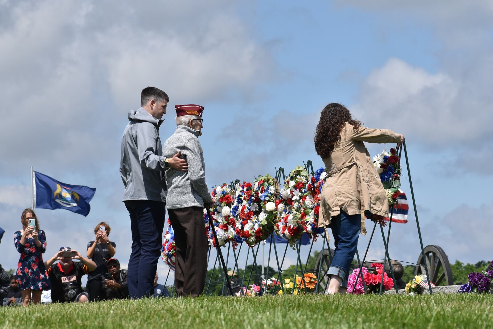 POW Albert Brown, a Lewisburg man who served in the infantry during World War II, lays a wreath during Monday's Memorial Day ceremony at the Dayton National Cemetery. SAM WILDOW\STAFF