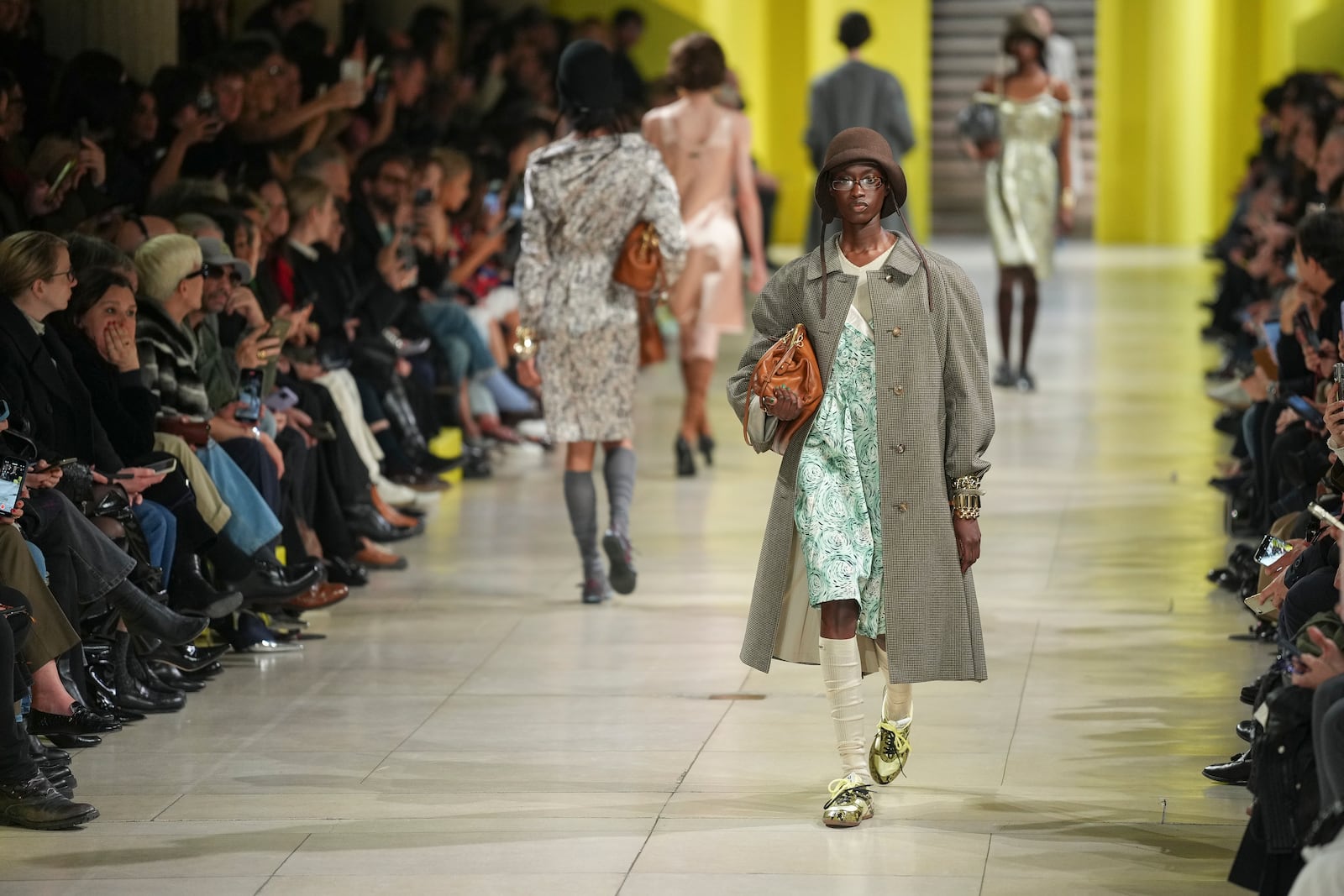 A model wears a creation as part of the Miu Miu Fall/Winter 2025-2026 Womenswear collection presented Tuesday, March 11, 2025. in Paris. (Photo by Scott A Garfitt/Invision/AP)