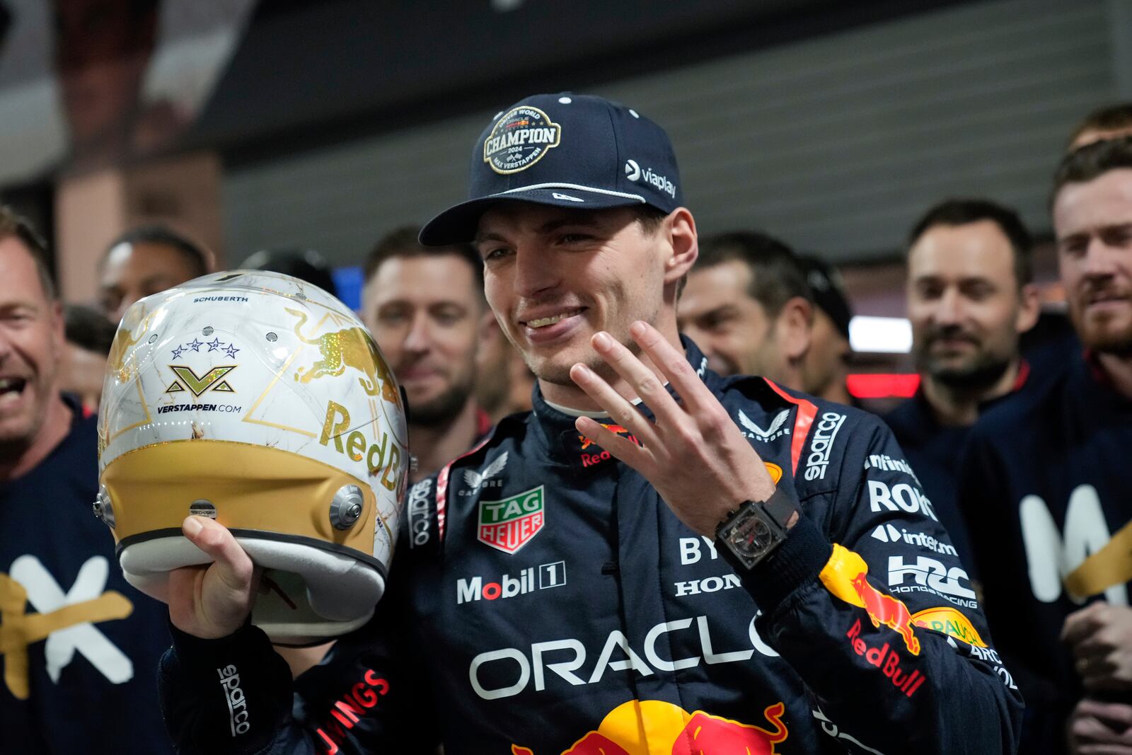 Red Bull driver Max Verstappen, of the Netherlands, celebrates winning the Formula 1 championship after the F1 Las Vegas Grand Prix auto race, Sunday, Nov. 24, 2024, in Las Vegas. (AP Photo/Matt York)