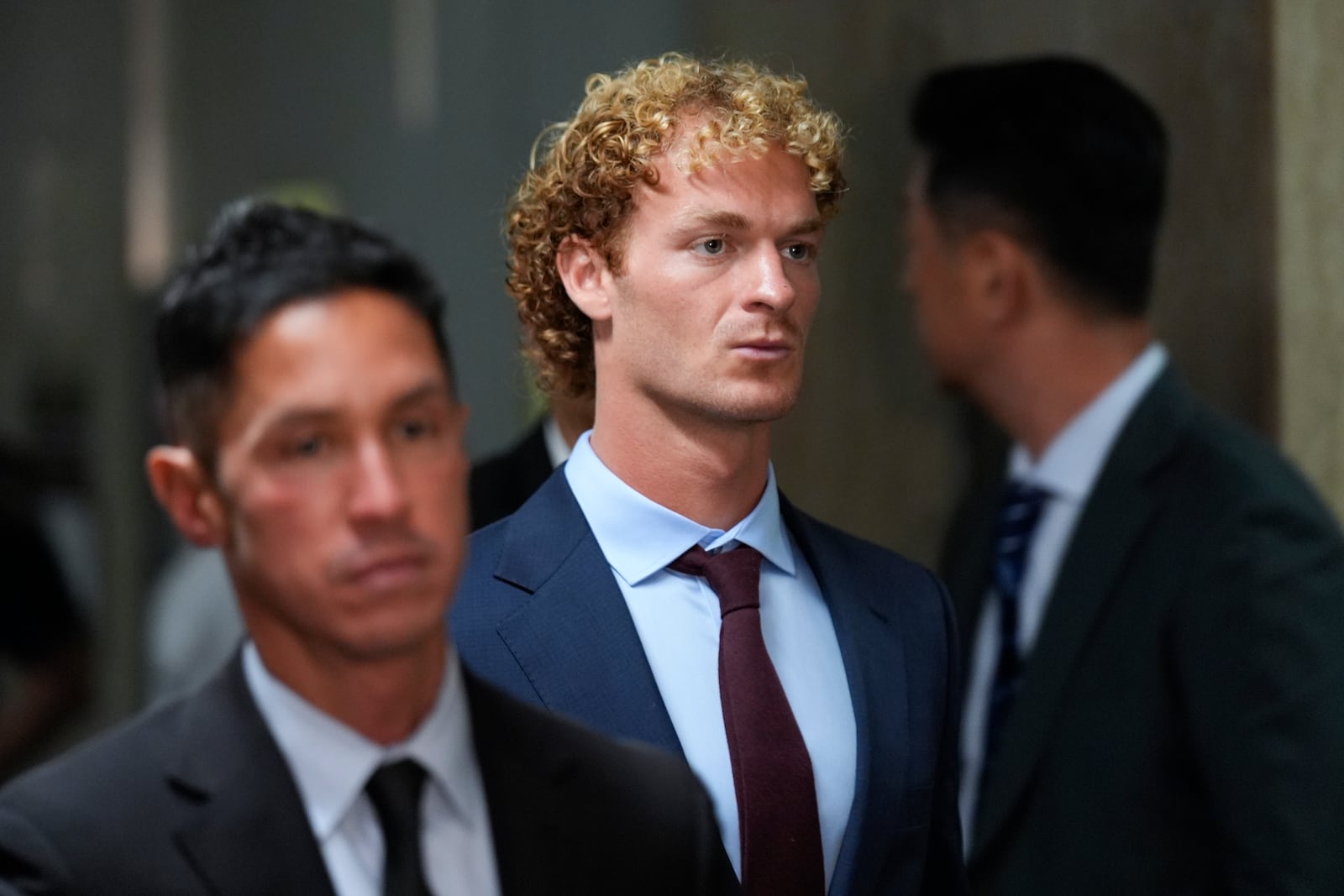 Daniel Penny leaves the courtroom during a break in New York, Monday, Oct. 21, 2024. Jury selection is set to begin in the criminal trial of the U.S. Marine Corps veteran who placed a man in a deadly chokehold aboard a New York City subway train last year. (AP Photo/Seth Wenig)