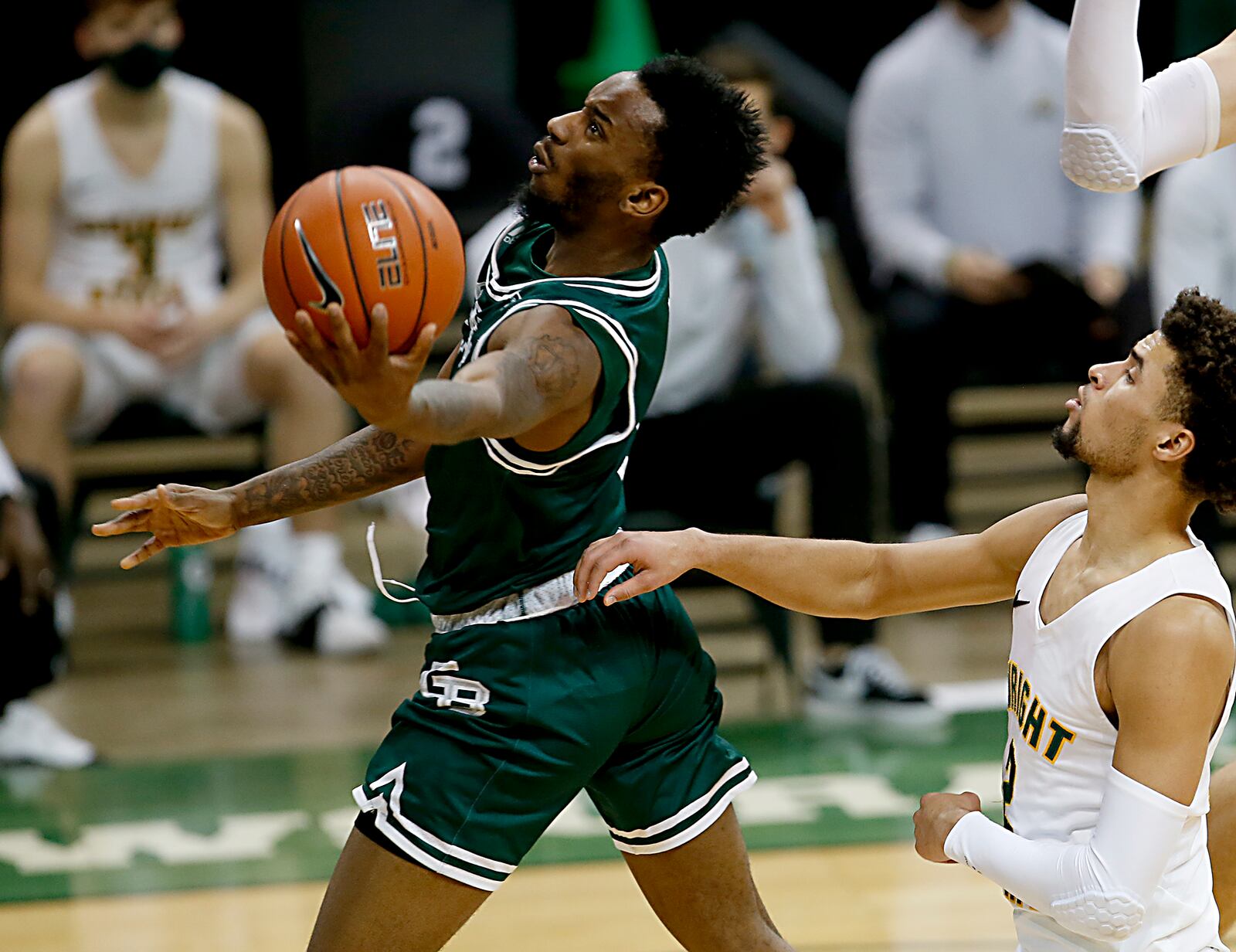 Green Bay guard Amari Davis moves to the hoop against Wright State guard Tanner Holden during a men's basketball game at the Nutter Center in Fairborn Saturday, Dec. 26, 2020. E.L. Hubbard/CONTRIBUTED