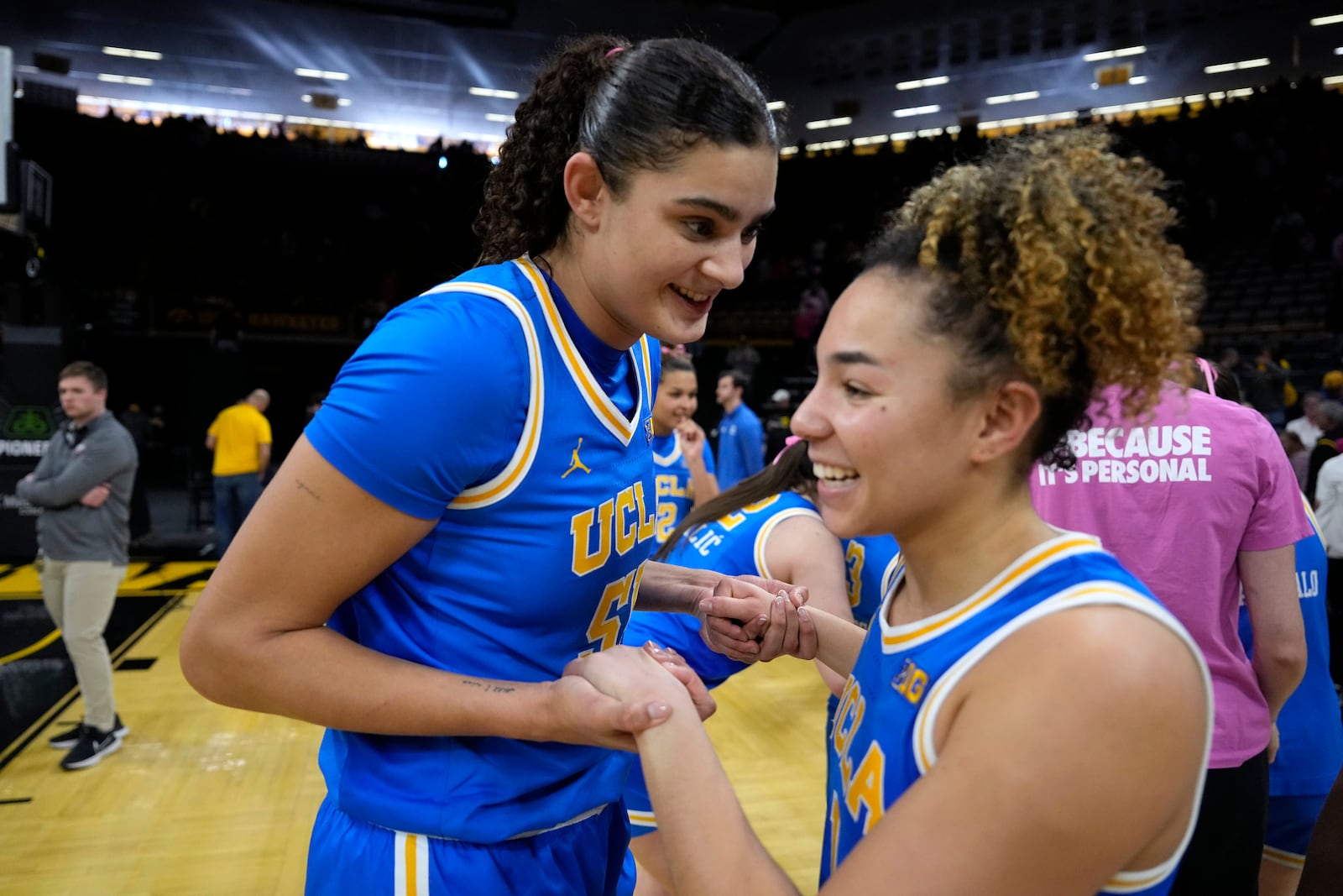 UCLA center Lauren Betts, left, celebrates with teammate guard Kiki Rice, right, after an NCAA college basketball game against Iowa, Sunday, Feb. 23, 2025, in Iowa City, Iowa. (AP Photo/Charlie Neibergall)