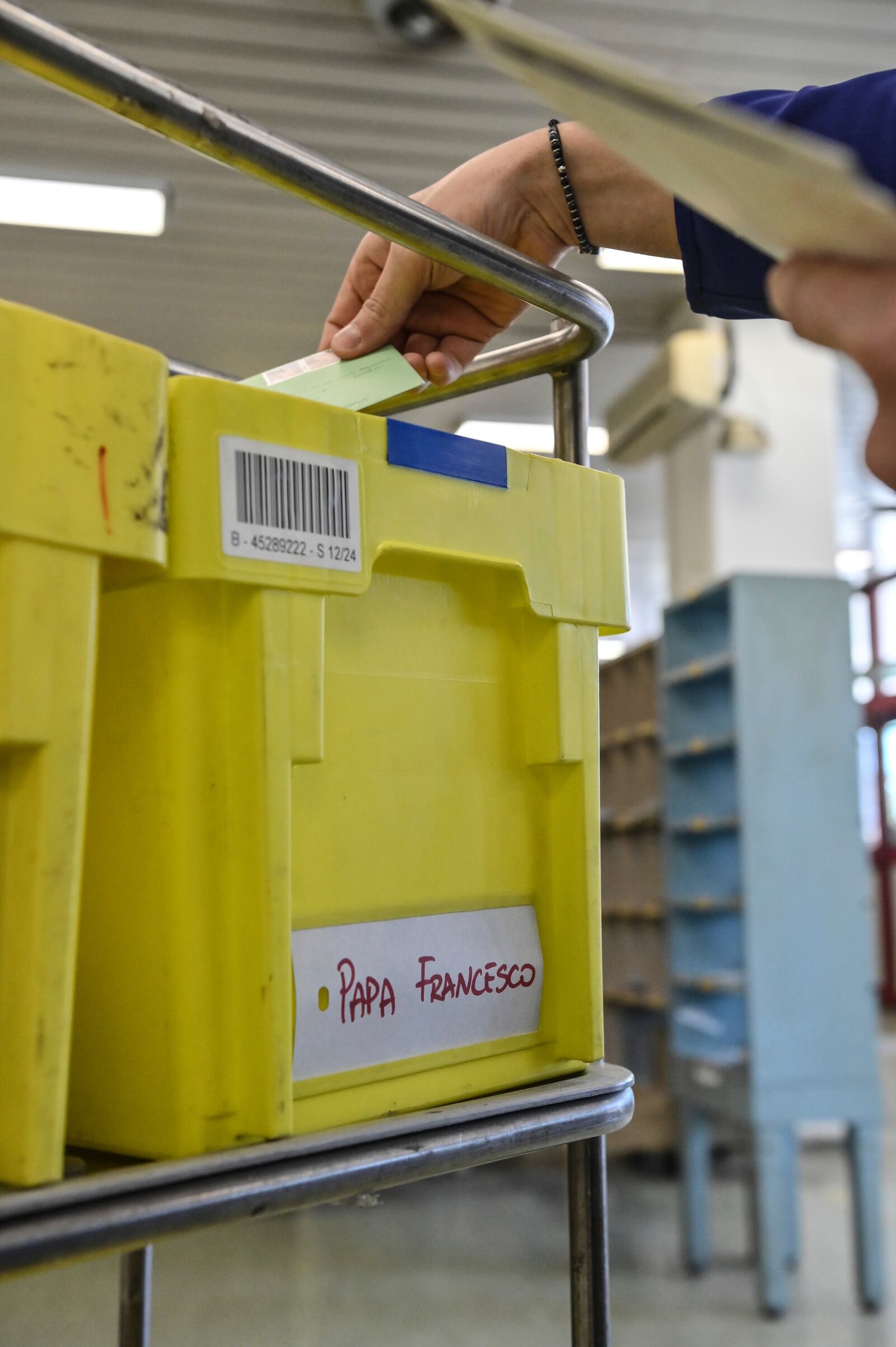 An employee of the Belsito postal distribution center in Rome sorts letters addressed to Pope Francis, who is currently being treated at Rome's Agostino Gemelli Polyclinic for bilateral pneumonia, Wednesday, March 19, 2025. (AP Photo/Chris Warde-Jones)