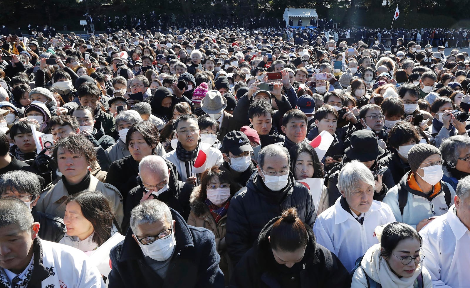 Well-withers gather as Japanese Emperor Naruhito, unseen, accompanied by other royal family members, appears on the balcony of the Imperial Palace in Tokyo on the emperor's 65th birthday, Sunday, Feb. 23, 2025. (Kyodo News via AP)