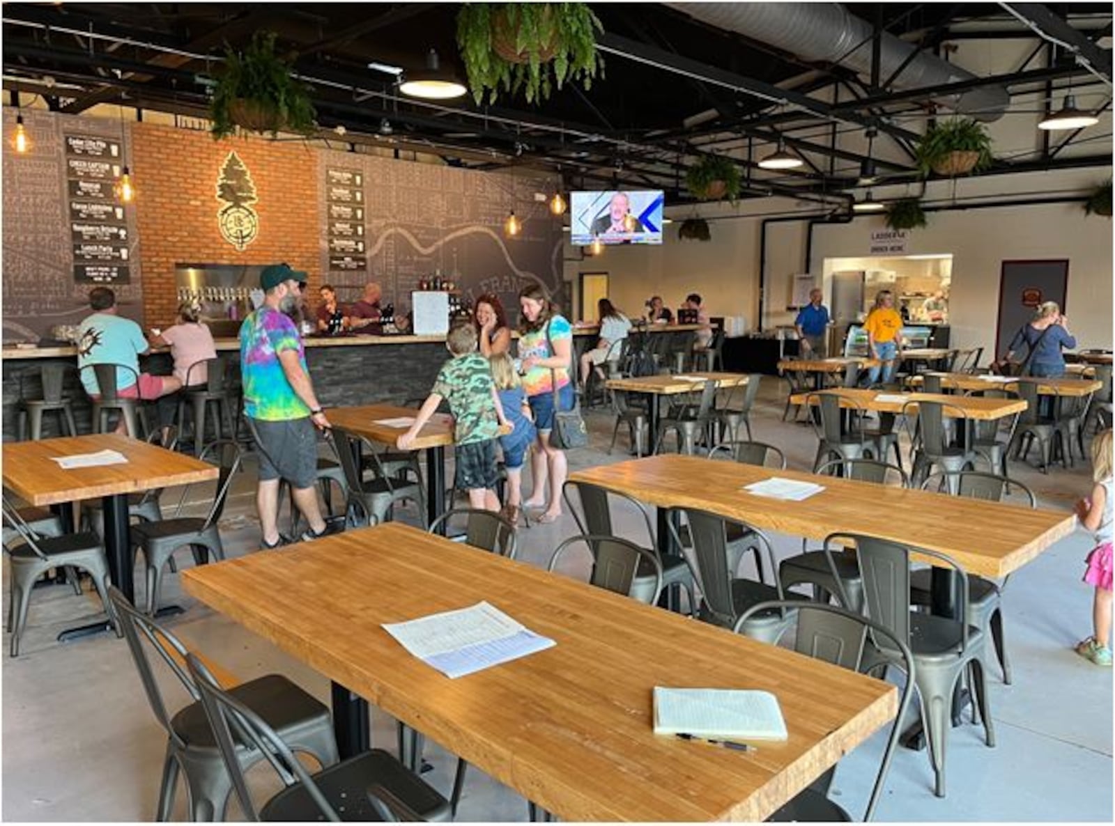 Patrons during a pre-opening event hang out at the Lebanon Brewing Company this week. The new brewery opens today. ED RICHTER/STAFF