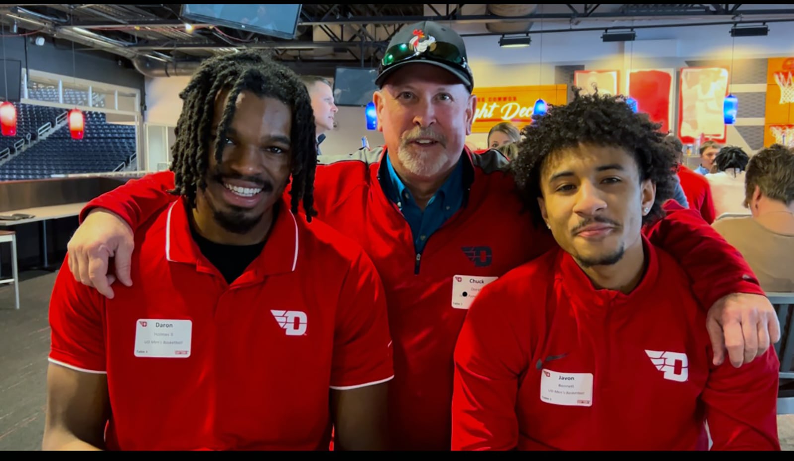 Doran's company and Lee's Famous Recipe are sponsors of the UD men's basketball team. L-R Daron Holmes II, Doran and current UD player Javon Bennett taken at the Connor Flight Deck last year.