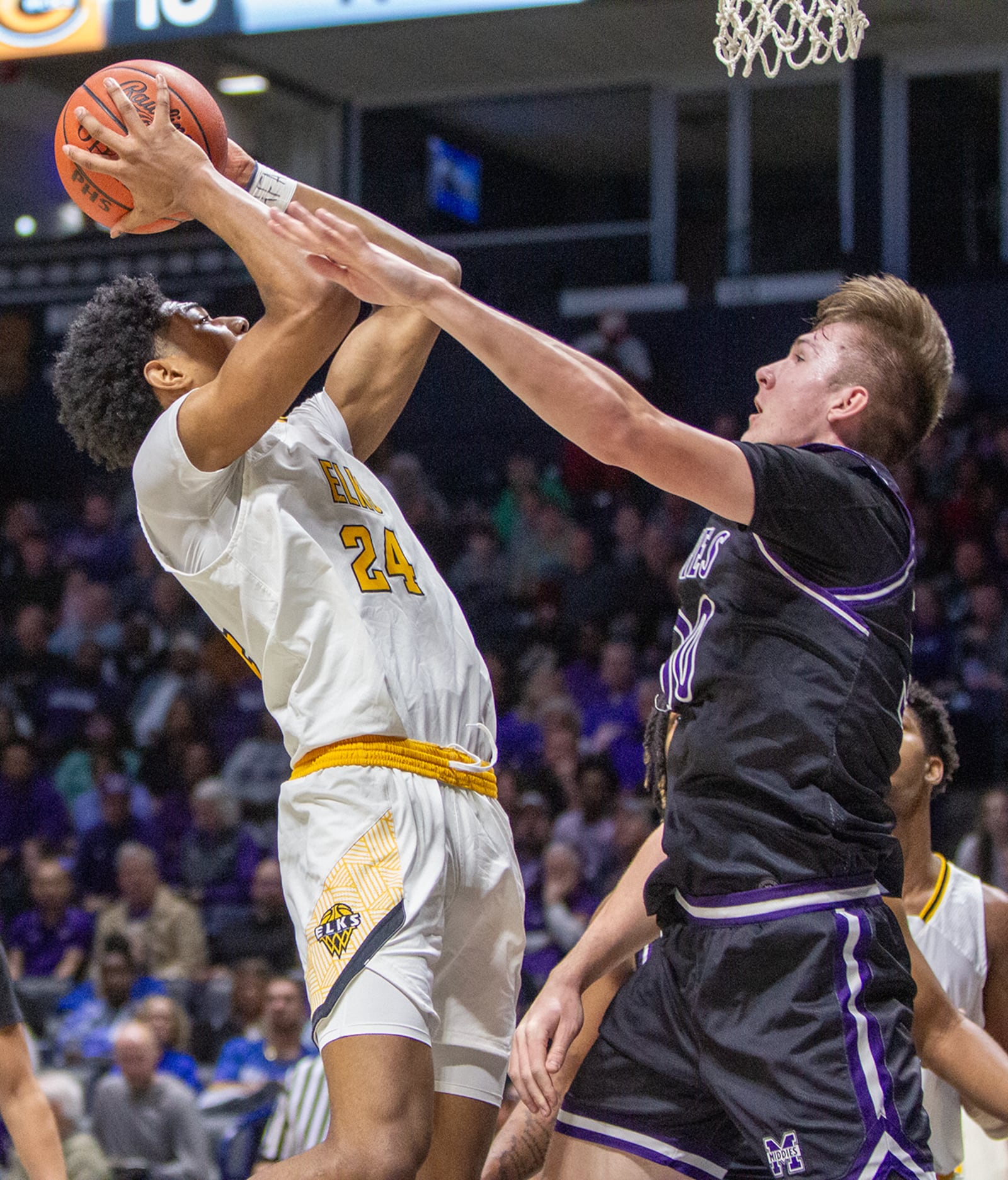 Centerville's Baboucarr Njie shoots against against Middletown's Isaac Stamper during Sunday's Division I district final at the Cintas Center. Jeff Gilbert/CONTRIBUTED