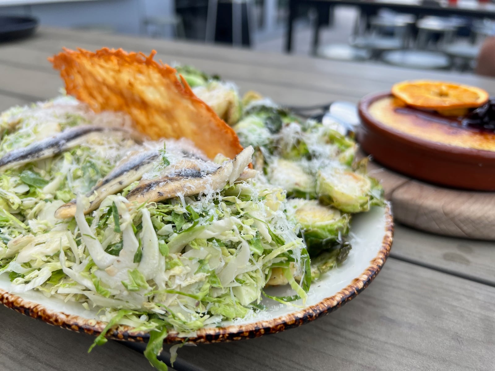 Brussels sprout Caesar salad dusted with pecorino and served with optional white anchovies served at the Foundry restaurant at the AC Hotel in downtown Dayton.