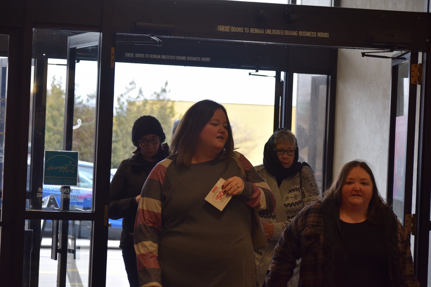 PHOTOS: Hundreds like up outside JCPenney for doorbusters, coupons