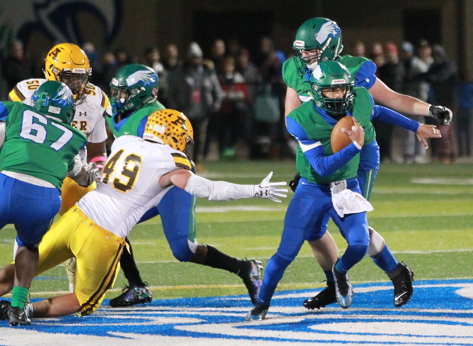 Chaminade Julienne QB Ryan Minor (with ball) eludes Ethan Deep of Alter. Alter defeated host CJ 35-28 in a Week 10 high school football game on Friday, Nov. 1, 2019. MARC PENDLETON / STAFF