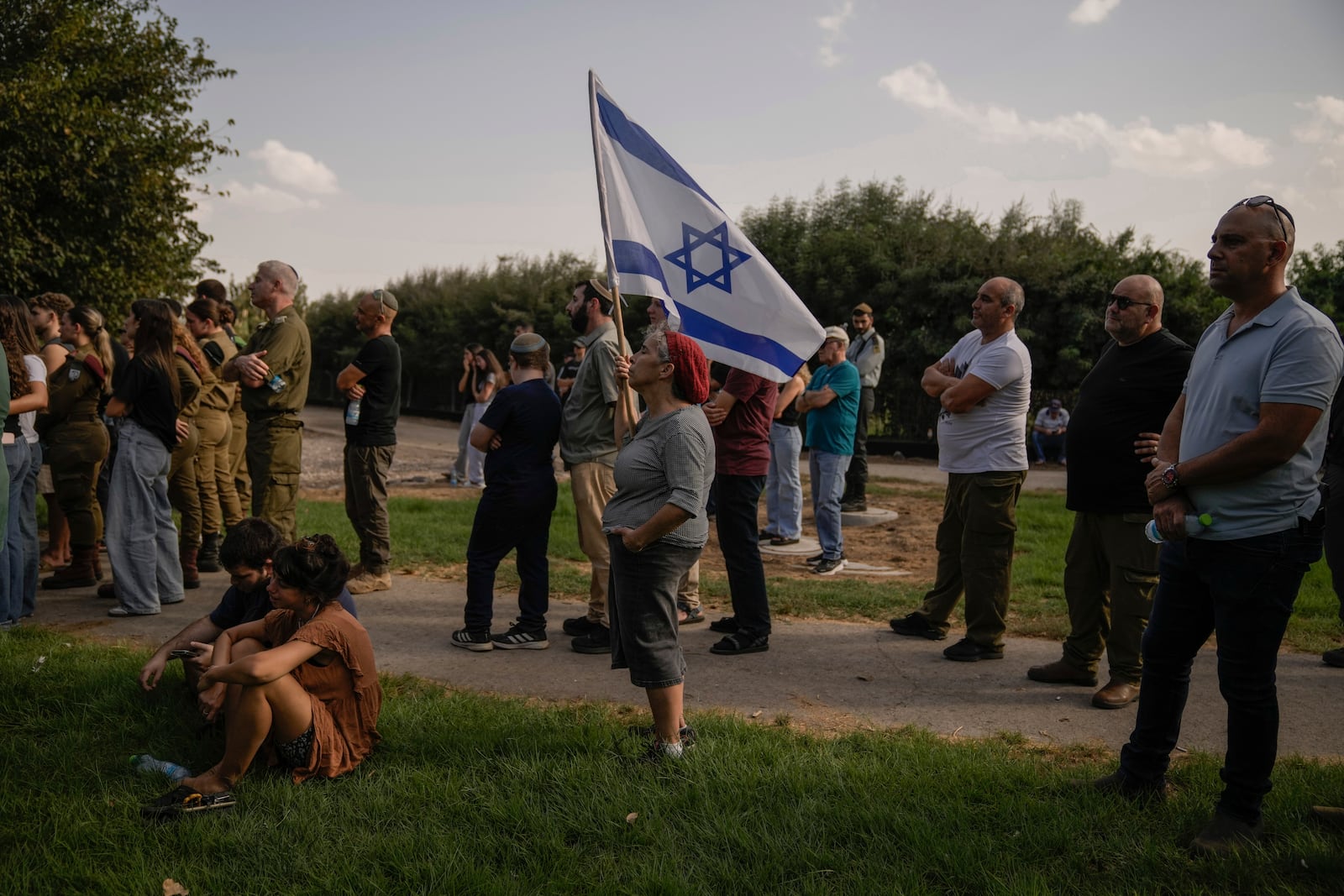 People mourn Israeli soldier Sgt. Amitai Alon, killed by a Hezbollah drone attack, during his funeral near Ramot Naftali, Israel, Monday, Oct. 14, 2024. (AP Photo/Leo Correa)