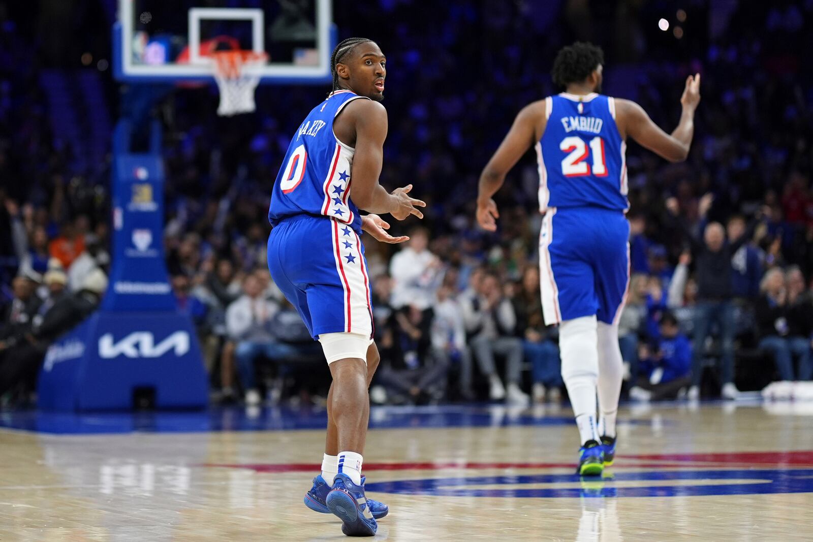 Philadelphia 76ers' Tyrese Maxey, left, and Joel Embiid react during the second half of an NBA basketball game against the Dallas Mavericks, Tuesday, Feb. 4, 2025, in Philadelphia. (AP Photo/Matt Slocum)