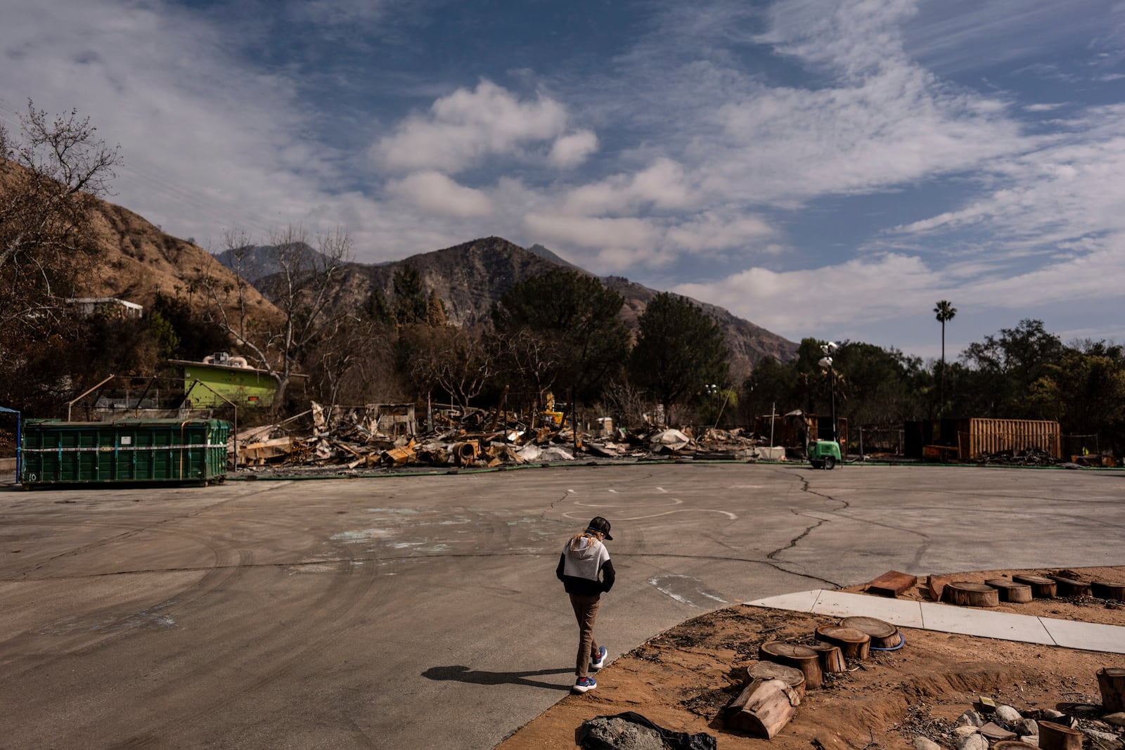 Ceiba Phillips, an 11-year-old Eaton Fire evacuee, visits his school gutted by the fire in Altadena, Calif., Saturday, Feb. 8, 2025. (AP Photo/Jae C. Hong)