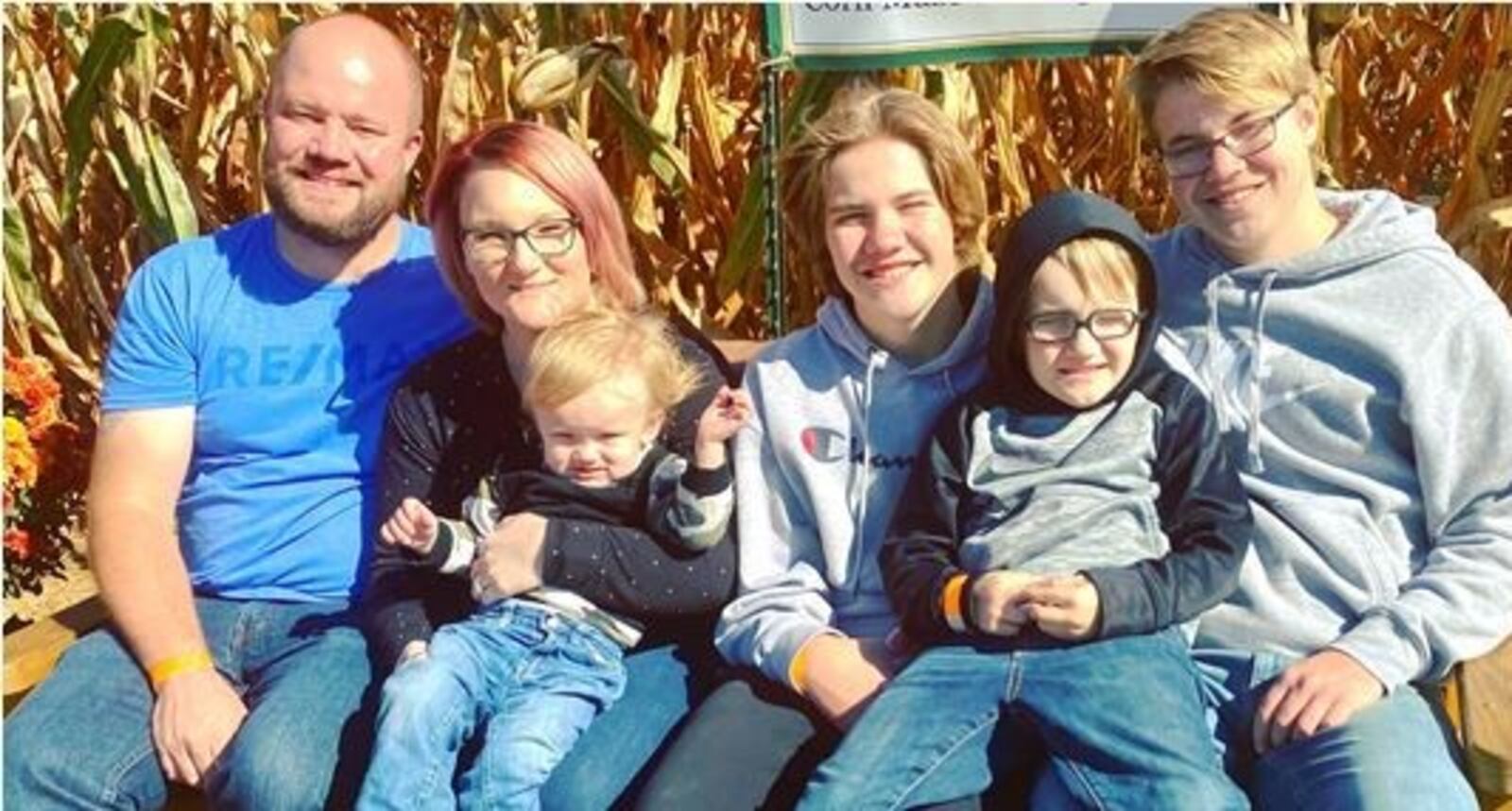 Paul Jewett, who died Saturday at 37 from Covid, with his wife and sons. PROVIDED