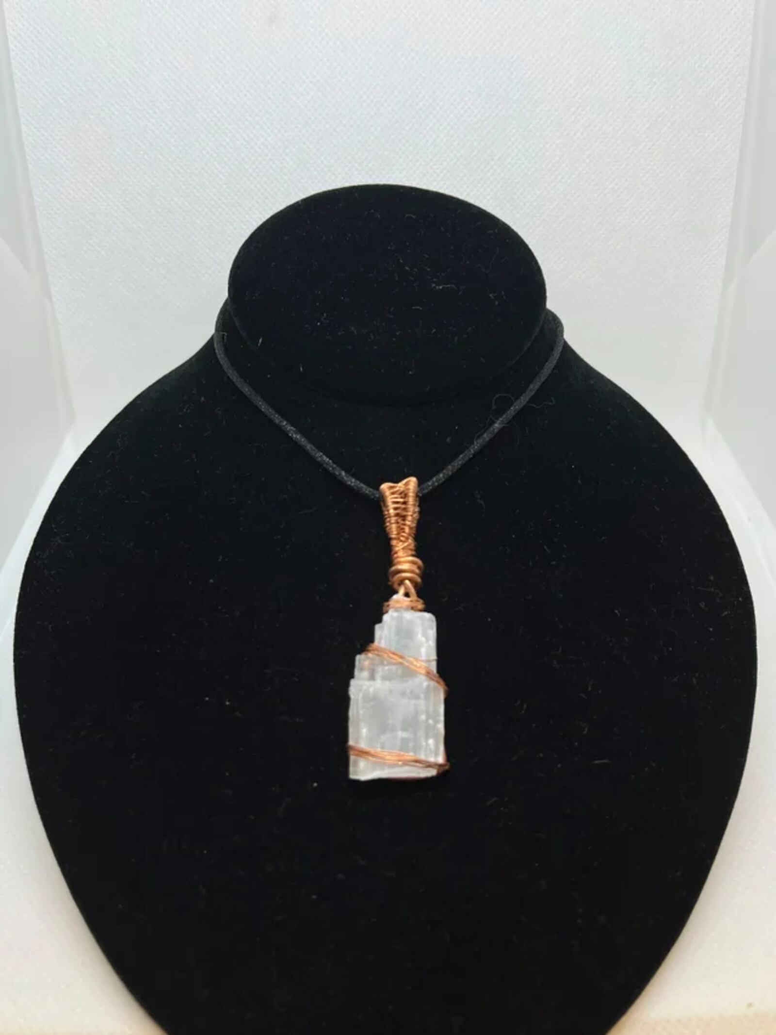 Copper-wrapped Selenite pendant is among authentic and inspired Native American jewelry items offered at the SunWatch Gift Shop at SunWatch Indian Village and Archaeological Park in Dayton.   CONTRIBUTED PHOTO