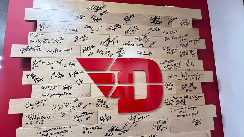 The Dayton basketball alumni board, signed by former players, is located in the coaches' offices at UD's Cronin Center. David Jablonski/Staff
