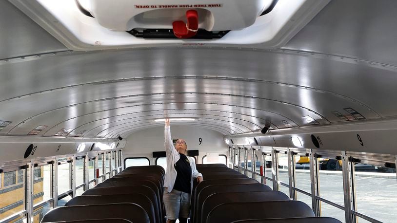 Centerville bus driver Janelle Kime checks the emergency exits and goes through her safety checks Tuesday, Aug. 20, 2024 on her bus before picking students. These checks are done every day. MARSHALL GORBY\STAFF