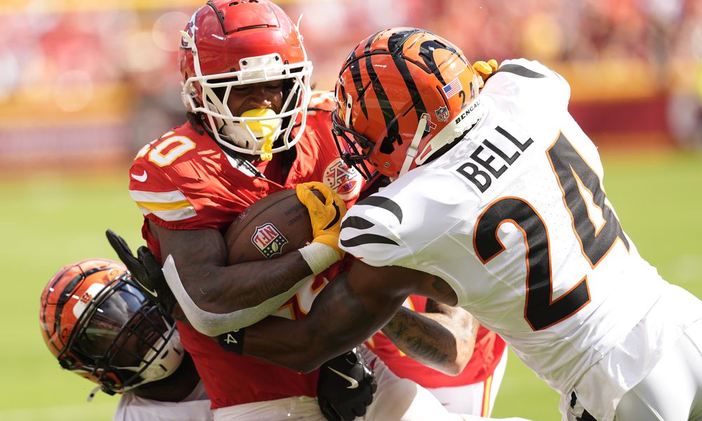 Kansas City Chiefs running back Isiah Pacheco (10) is stopped by Cincinnati Bengals safety Vonn Bell (24) during the first half of an NFL football game Sunday, Sept. 15, 2024, in Kansas City, Mo. (AP Photo/Charlie Riedel)