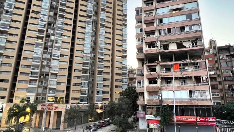 Damaged apartments, right, are seen in a building that was hit by Israeli strike, in Beirut, Lebanon, early Monday, Sept. 30, 2024. (AP Photo/Hussein Malla)