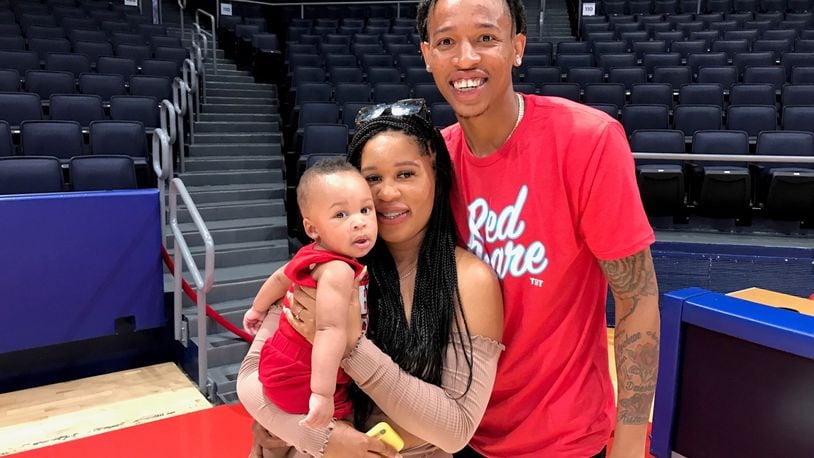 Joe Thomasson, his fiance LaDresha and their 7 month old son Jesiah at UD Arena on Wednesday. Tom Archdeacon photo