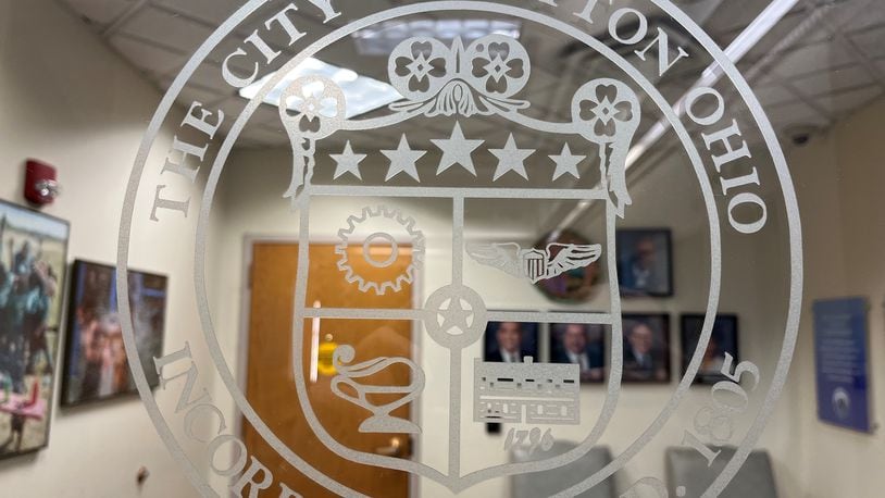 The city of Dayton seal on the door to the offices of the Dayton City Commission. CORNELIUS FROLIK / STAFF