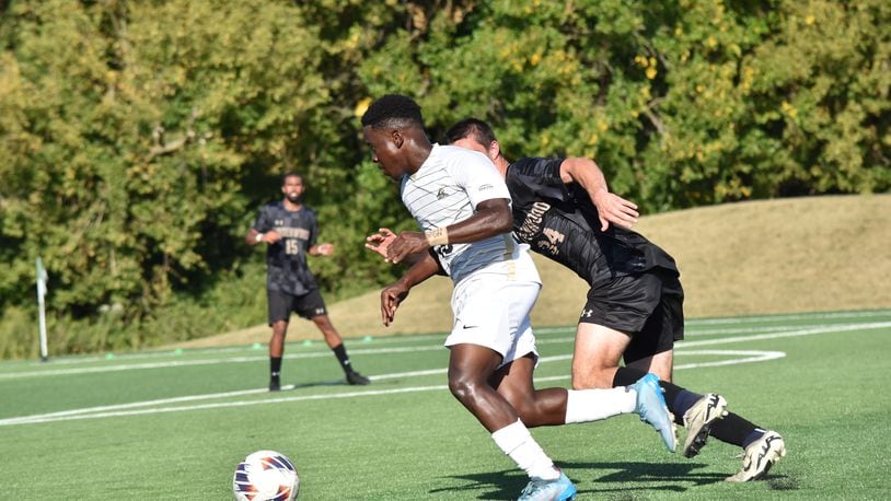 Wright State's Brian Burkett (left) beats a Lindenwood defender during a game earlier this season. Wright State Athletics photo