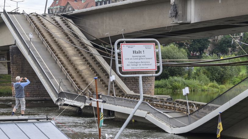 Parts of the Carola Bridge over the Elbe have collapsed in Dresden, Germany, Wednesday, Sept. 11, 2024. (Robert Michael/dpa via AP)