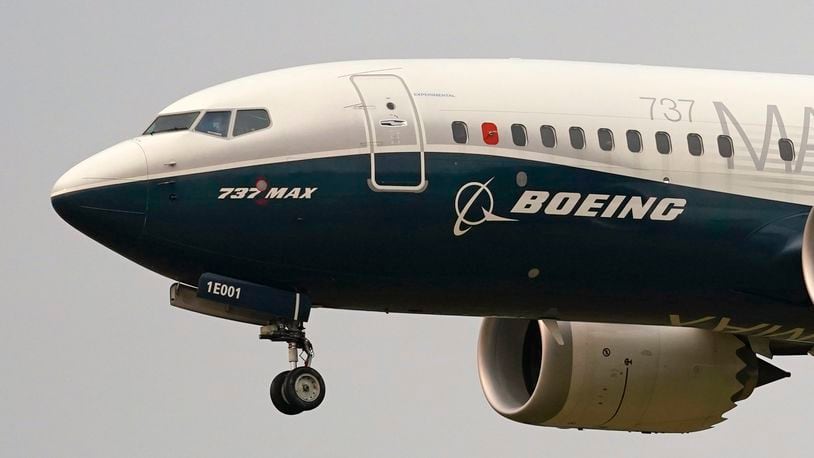 FILE - A Boeing 737 Max jet prepares to land at Boeing Field following a test flight in Seattle, Sept. 30, 2020. Two U.S. senators have asked the Department of Justice to take tougher action against Boeing executives by holding them criminally accountable for safety issues that have impacted its airplanes, Thursday, Oct. 3, 2024. (AP Photo/Elaine Thompson, File)