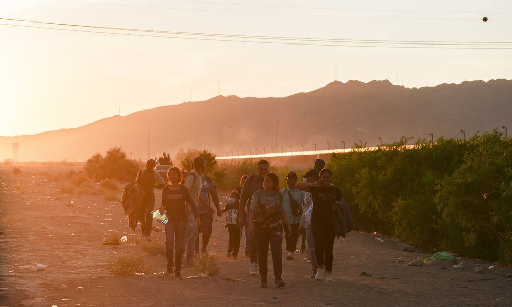  FILE â Migrants walk along the Rio Grande in search of a place to cross the U.S.-Mexico border, in Ciudad Juarez, Mexico, on June 4, 2024. In the months since President Biden imposed sweeping restrictions on asylum at the U.S.-Mexico border, the policy appears to be working exactly as he hoped and his critics feared. (Paul Ratje/The New York Times) 