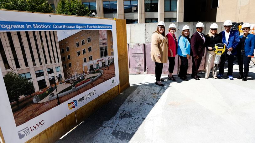 From left, Stephanie Keinath, of the Dayton Area Chamber of Commerce; Judy Dodge, Carolyn Rice, Michael Colbert and Debbie Lierberman, of the Montgomery County commission; Dayton Mayor Jeff Mims Jr.; and Katie Meyer, of the Downtown Dayton Parternship gather in front of the fountain at Courthouse Square. The renovation project will be completed in time for Christmas, officials said. MARSHALL GORBY\STAFF