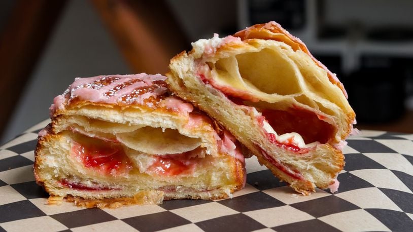 Pictured is the Strawberry Mascarpone’s Pain au Chocolat (strawberry white chocolate and mascarpone cream in a croissant with strawberry glaze and powdered sugar) at Val's Bakery in Dayton (CONTRIBUTED PHOTO).