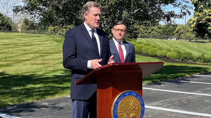 U.S. Rep. Mike Turner, R-Dayton, at the podium, with Speaker of the House Mike Johnson outside the Hope Hotel and Conference Center earlier this year. THOMAS GNAU/STAFF