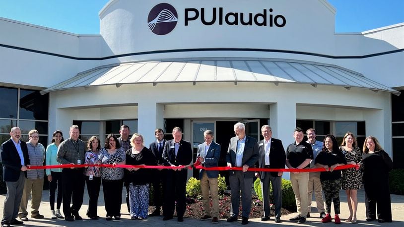 City and county officials and members of sound design and distribution company PUI Audio cut the ribbon on the company's new Fairborn location Monday.