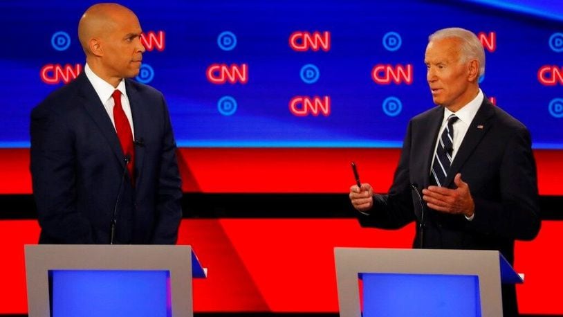 Sen. Cory Booker, D-N.J., listens as former Vice President Joe Biden speaks during the second of two Democratic presidential primary debates hosted by CNN Wednesday, July 31, 2019, in the Fox Theatre in Detroit.