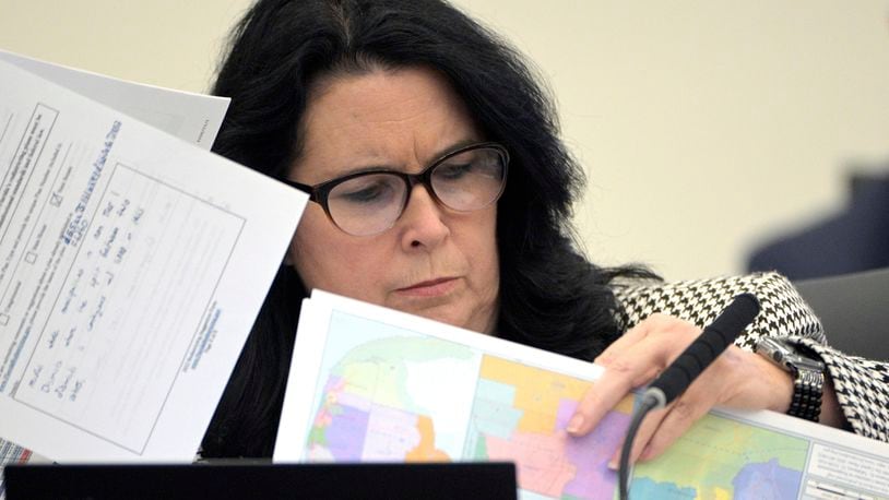 FILE - State Sen. Kelli Stargel looks through redistricting maps during a Senate Committee on Reapportionment hearing on Jan. 13, 2022, in Tallahassee, Fla. Civil rights groups have challenged how four congressional districts and seven state House districts in South Florida were drawn by the Republican-controlled Florida Legislature, claiming they were racially gerrymandered. The civil rights groups filed a lawsuit on Thursday, May 23, 2024, claiming the districts are unconstitutional and asking a federal court in South Florida to stop them from being used for any elections. (AP Photo/Phelan M. Ebenhack, File)