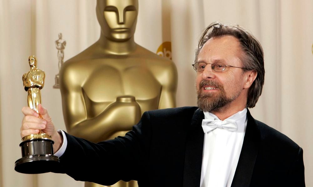 FILE - Jan. A.P. Kaczmarek poses with the Oscar for best original score for his work on 