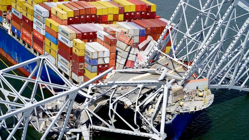 FILE - In this aerial image released by the Maryland National Guard, the cargo ship Dali is stuck under part of the structure of the Francis Scott Key Bridge after the ship hit the bridge, March 26, 2024, in Baltimore. (Maryland National Guard via AP, File)