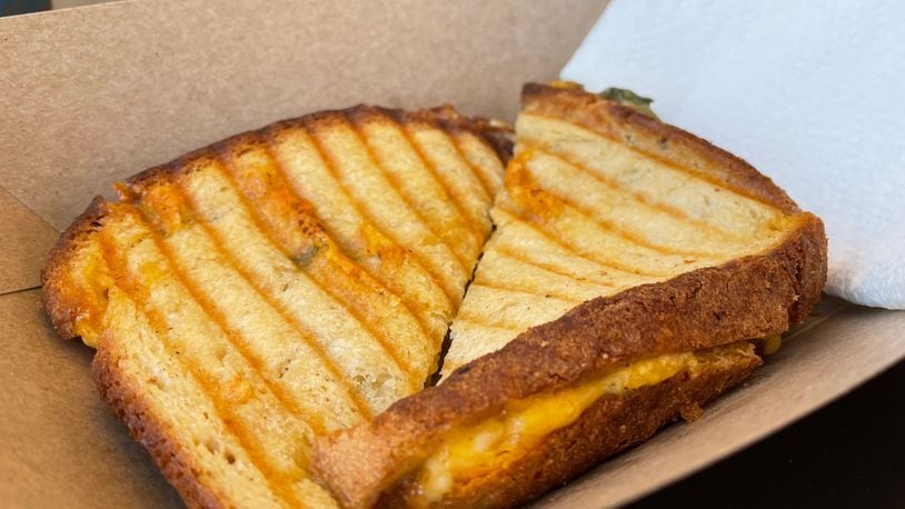 Socialite Cafe, a European-style cafe in Kettering, is open at 4011 Marshall Road. Pictured is The Jackie O' Cali Grilled Cheese. NATALIE JONES/STAFF